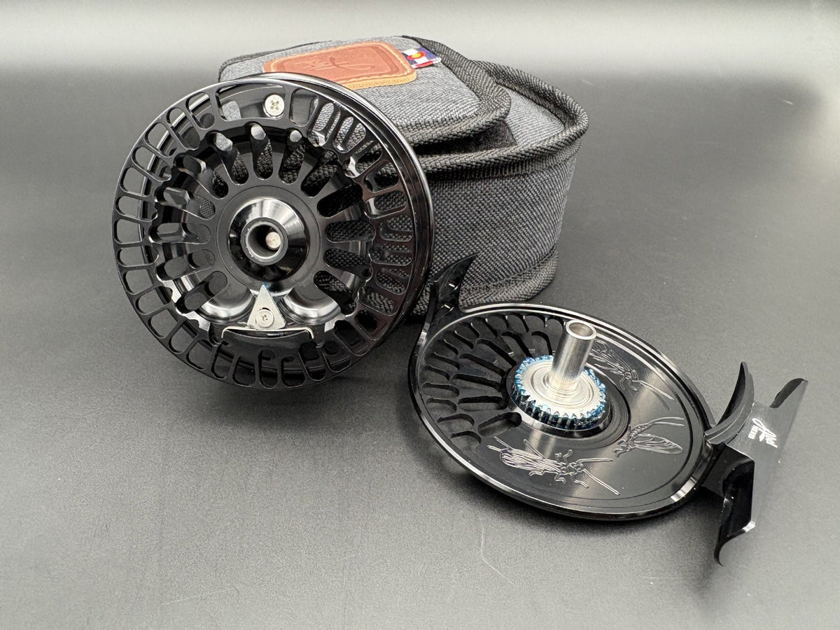 Abel TR Fly Reels in Black with classic click-pawl design - open with case