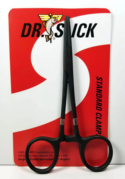 Black clamp scissors on a red and white Dr. Stick packaging background